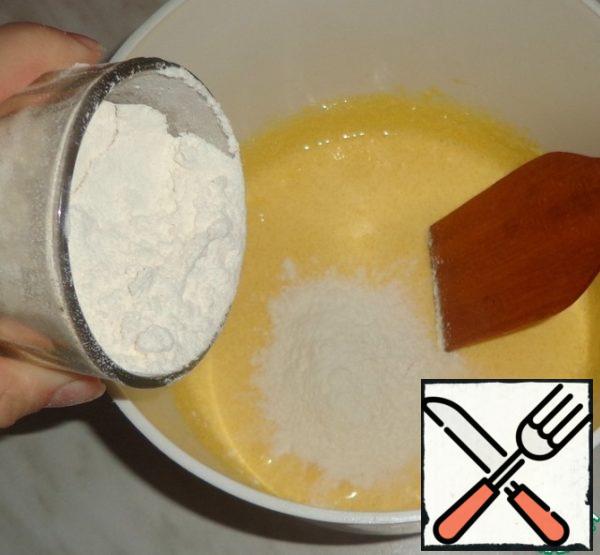 Add the sifted flour and baking powder to the dough. Mix it. Add vanilla to taste.
