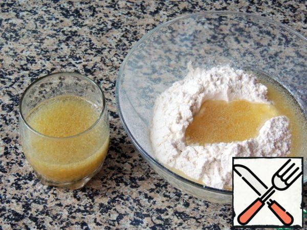 Pour the flour into a large bowl. Mix the liquid components and pour into the flour.
