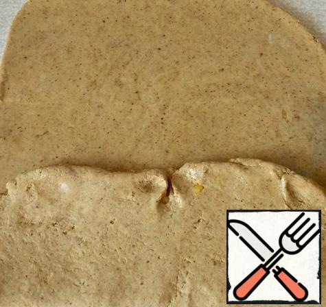 Now roll it into a rectangle and lubricate the surface of 1.5 tbsp oil and fold 1/3 of the dough.