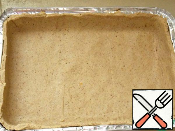 Then roll out the dough and put it in a mold.
