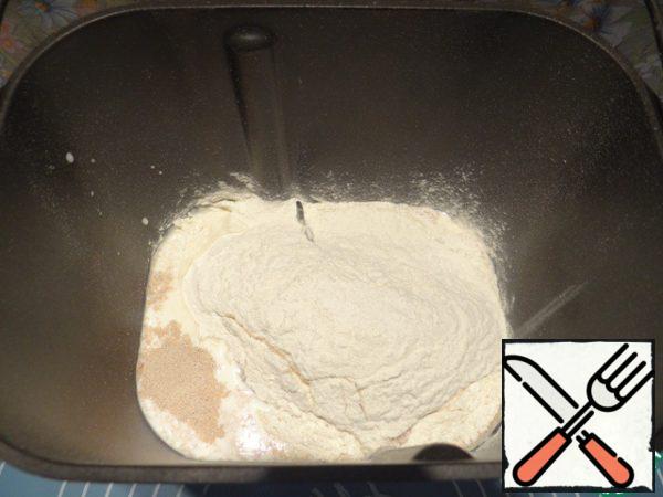 Add sifted flour, salt, sugar.