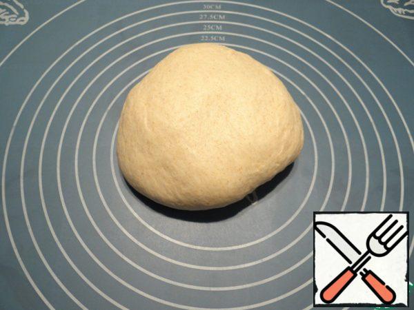 Shift the dough on the table, knead well.