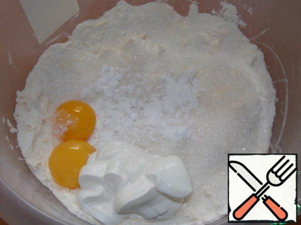 Add yolks, sour cream, baking powder, sugar.