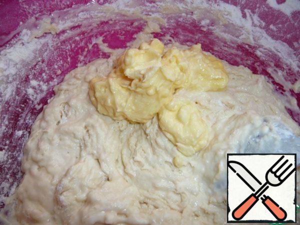 Add half of the flour and mix. Add the soft butter and stir.