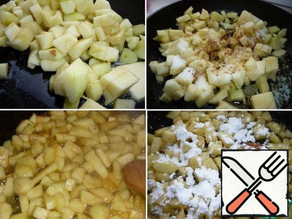 Preparing the filling. Put butter, apples (peel and seeds, cut into cubes), lemon zest, sugar and cinnamon in a frying pan. Simmer uncovered for 5 minutes, stirring regularly. Then add the starch, stir, remove from heat and cool.
