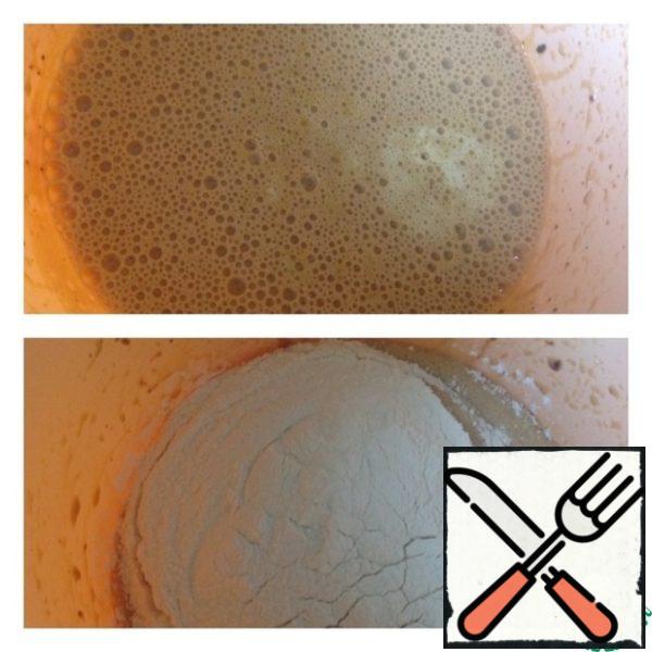 Pour in the oil and mix. Add baking powder and flour. Whisk for just a couple of seconds.
