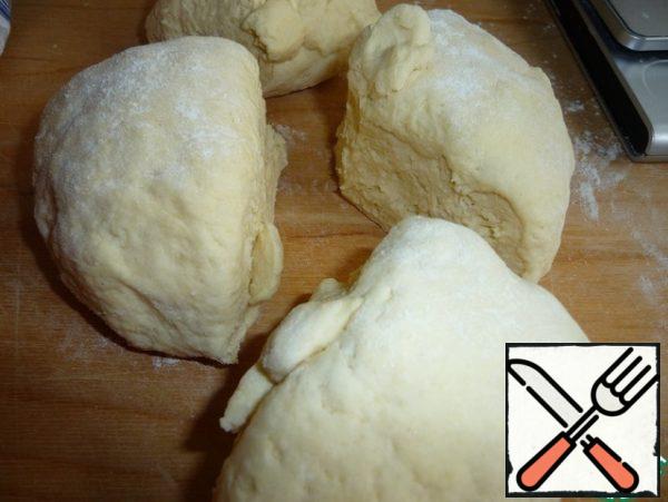 The dough is divided into four parts.