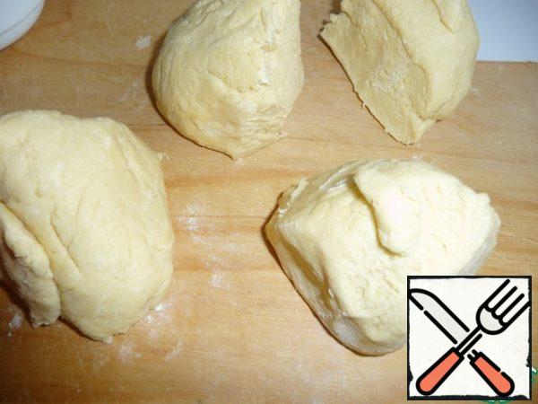 The cooled dough is divided into four parts.