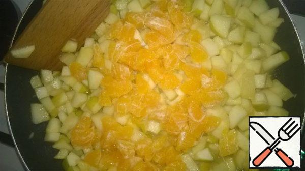 As soon as the apples are brought to semi-readiness, add the tangerines and continue to simmer.