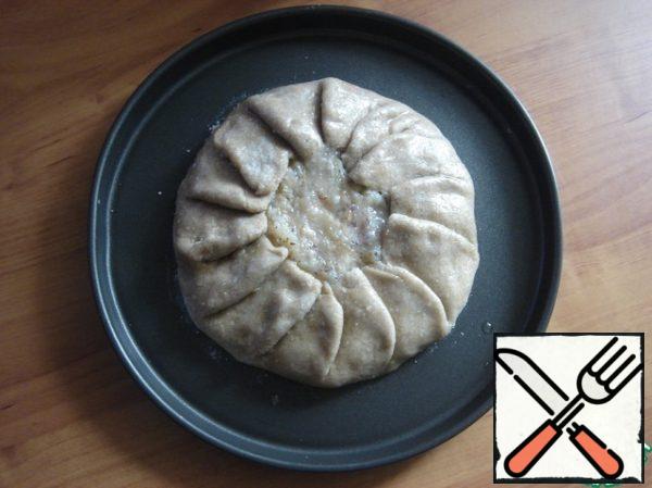 Gently tuck the edges with tongs. Brush the rolled dough with sunflower oil. Place in a preheated oven for 30 minutes at t-180 C. Focus on your oven.
