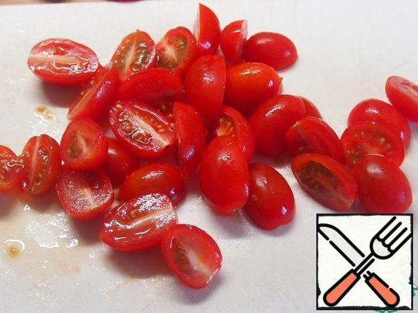 Cherry tomatoes cut in half, add to the salad.
