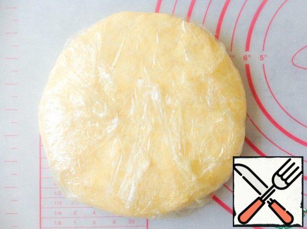 Flatten the dough into a disk. Wrap in cling film and refrigerate for at least 1 hour to cool.