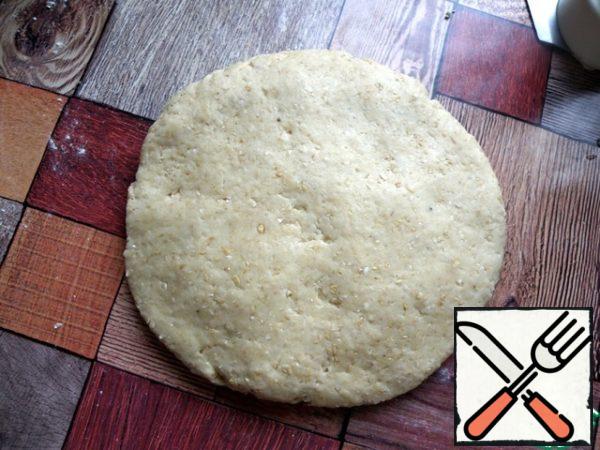 Ready dough is rolled into a circle and placed in a ziploc and in the freezer for 15 minutes. During this time, the oven to warm up to 200 degrees.