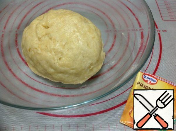 Mix flour with baking powder and salt, sift. In a bowl pour hot water, add oil and mix. Then pour the flour and knead the dough quickly (first with a spoon, then with your hands). The dough should be soft and non-sticky. Let the dough rest for 30 minutes.