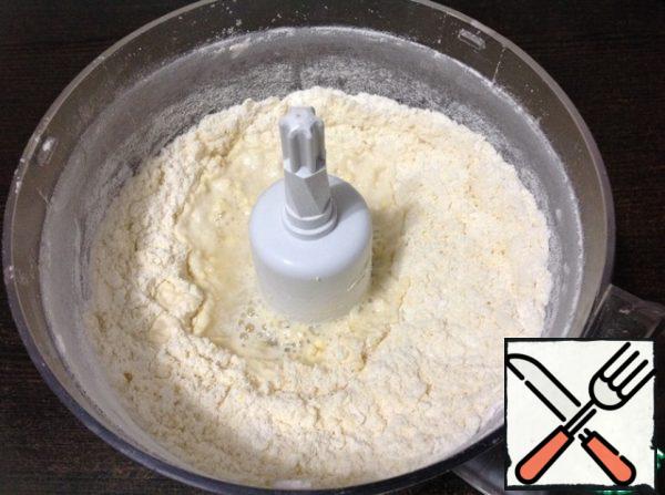 In a bowl of blender mix flour, salt, diced butter until coarse crumbs. Pour ice water.