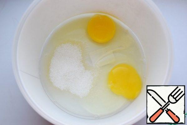 In a bowl drive eggs, add sugar, salt. Beat with whisk.