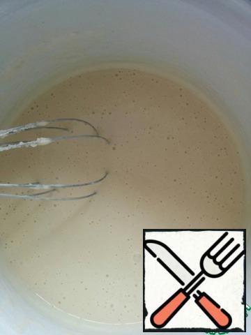 Add the sifted flour gradually. At the end, add water and oil. Stir until smooth and leave for 10-15 minutes.