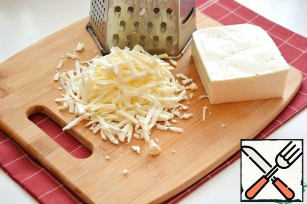 For the filling, grate the cheese.