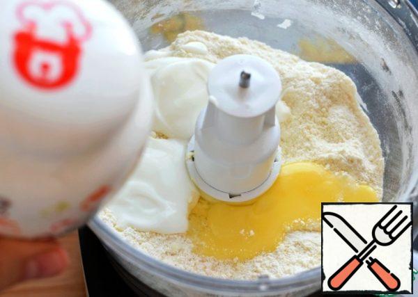 Add the yolk and a couple of tablespoons of thick yogurt.
