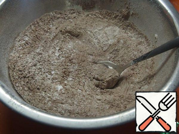 Sifted flour and cocoa mixed with powdered sugar.