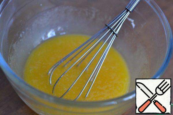 In a separate bowl, mix the powdered sugar, yolks and melted butter.