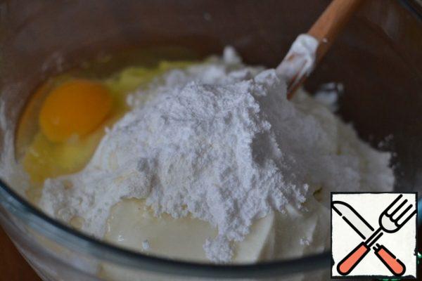 In a separate bowl, mix cottage cheese, powdered sugar, egg, vanilla sugar, pudding and lemon juice.