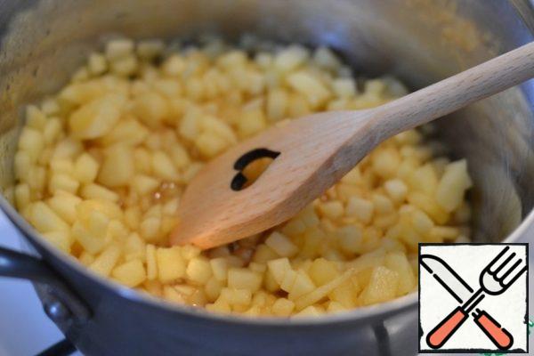 Gently add the apples to the hot sugar. Stir and simmer for a couple more minutes.

