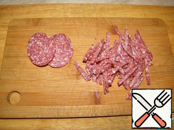 Also, cut the sausage into strips.