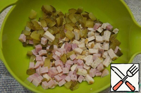 Chicken meat and ham cut into cubes or strips. Add diced cucumbers.
