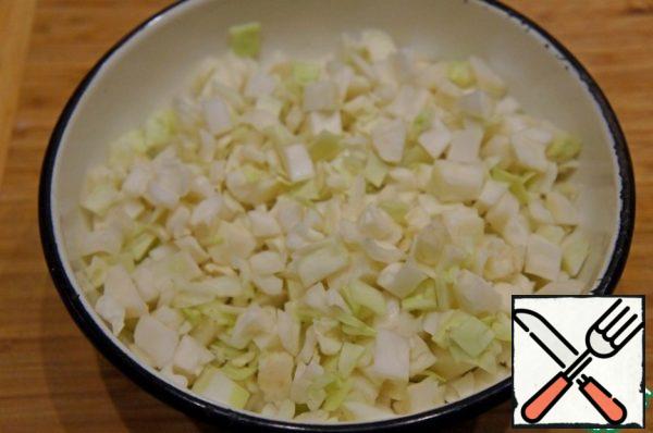 On Meat to cook the broth.
Cabbage cut into small squares.