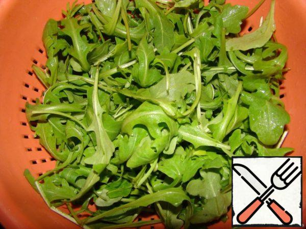 Wash the arugula.
