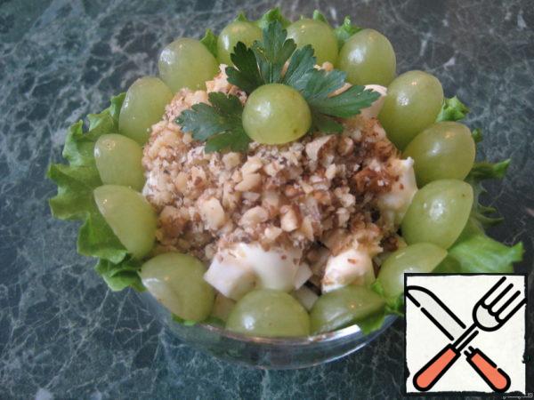 Decorate with nuts and grapes on top.