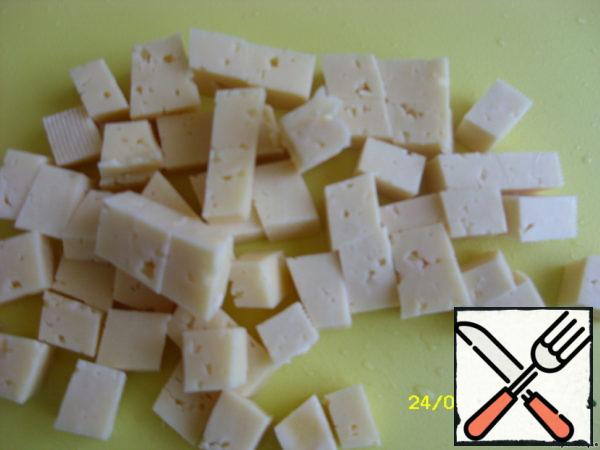 Cheese cut into large cubes.