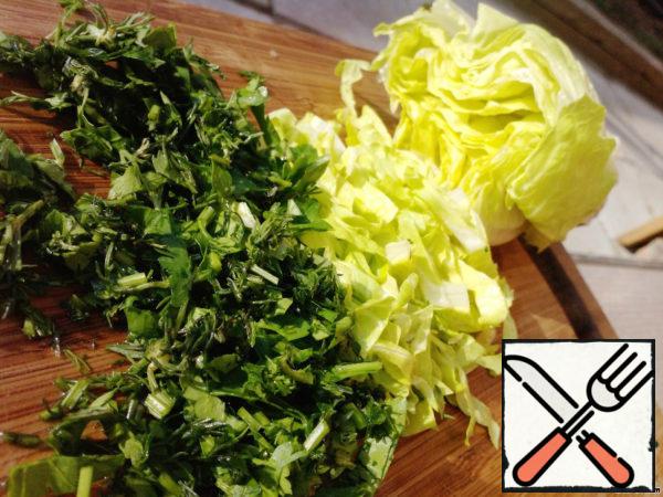 Chop the salad and greens.

