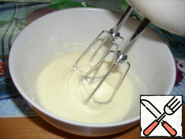 Eggs whites separate from yolks. Proteins put it in the refrigerator. Beat the yolks until white foam with a mixer.