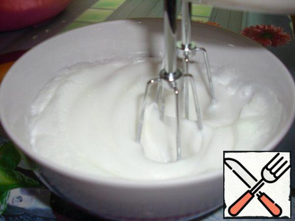 We get the eggs whites from the fridge. beat with a mixer. Put the beaten egg whites to the mixture. Gently mix.
