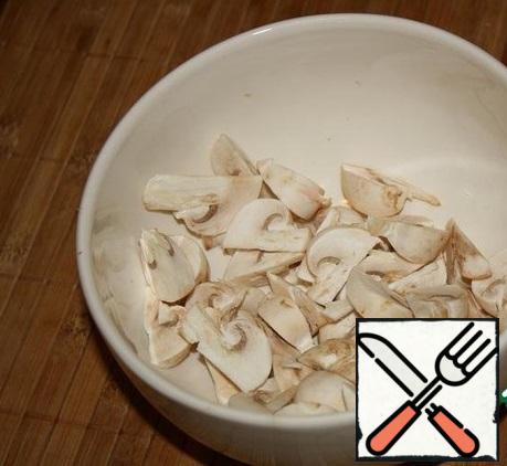It is good to wash and RUB the mushrooms-do not remove the Skin.
Cut into along quarters.