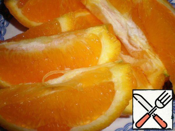 Cut the orange into slices, sprinkle with a little powdered sugar and bake, or fry in a frying pan or grill.