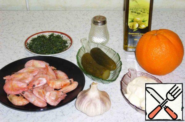 For sauce take one large orange, 2 cloves of garlic, mayonnaise 2 tablespoons, olive oil, shrimp approximately 20 pieces, 1 pickled cucumber, dill.