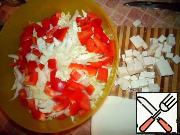 Pepper and cheese cut into pieces.