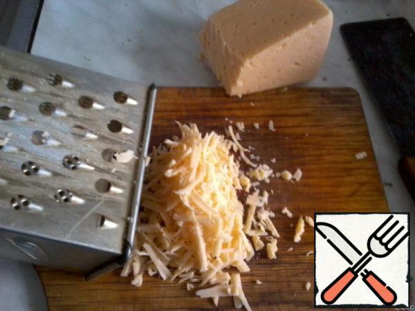 Grate cheese.