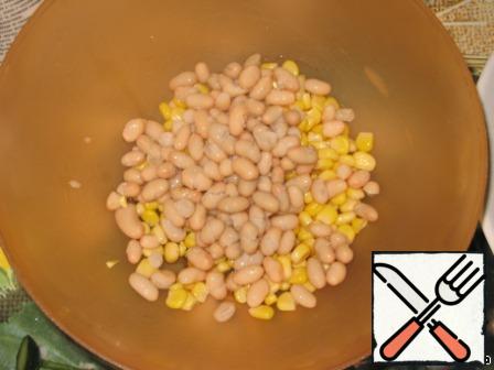 Wash beans, strain and add to corn.