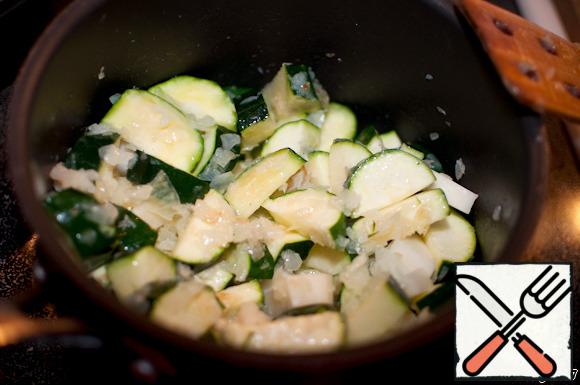 Add the potatoes to the zucchini and simmer for a few minutes.