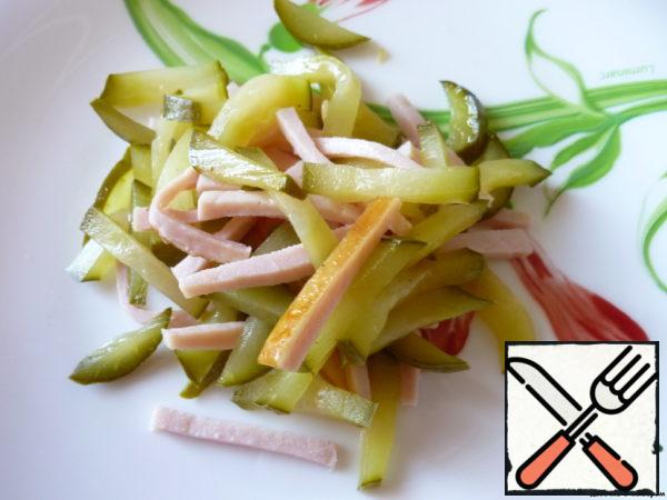 Pork, pickled cucumbers cut into small cubes.
