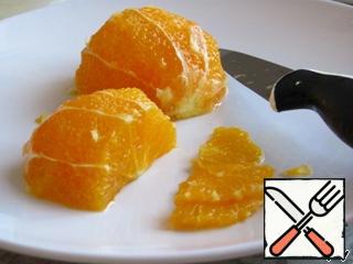 Peel the oranges, cut them in half, and then cut into thin semicircles.