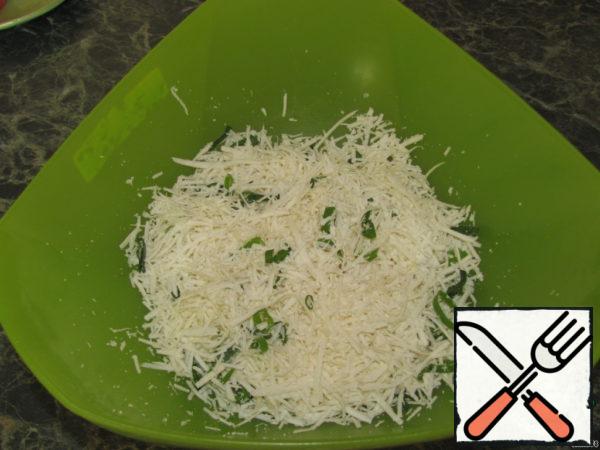 Cheese grate on a small grater. Finely chop the herbs and garlic. Add to the cheese and mix everything.