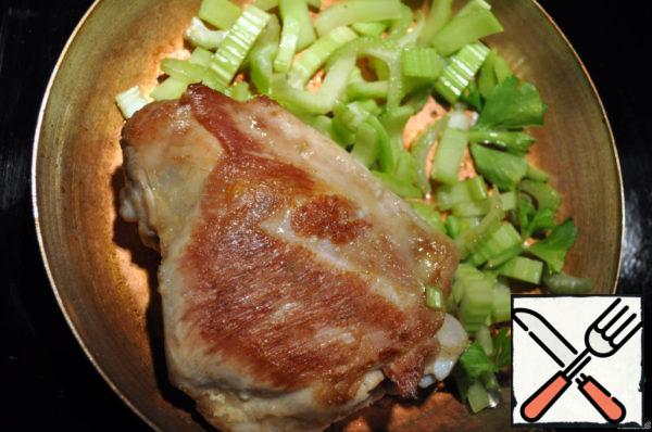 When the meat is almost ready, add the celery and fry everything together a little.

