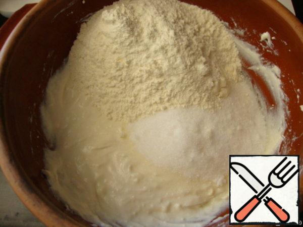 Then add sugar, flour and baking powder to the dough.
