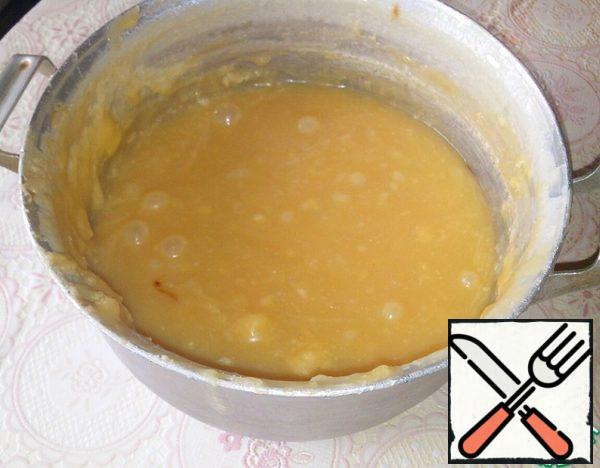 When condensed milk begins to" run away " and almost reaches the end of the pan, remove from heat and allow to cool.