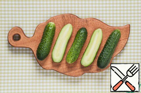 Wash and dry the cucumbers.
